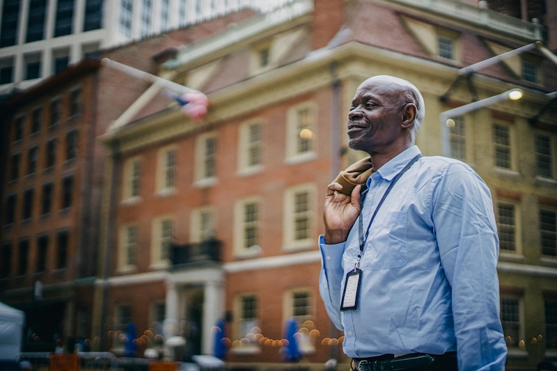 a man calmly crossing a street, representing emotional mastery