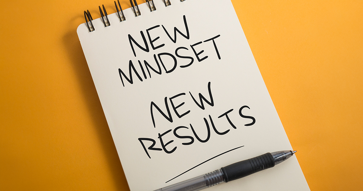 a notebook that says "new mindset, new results"