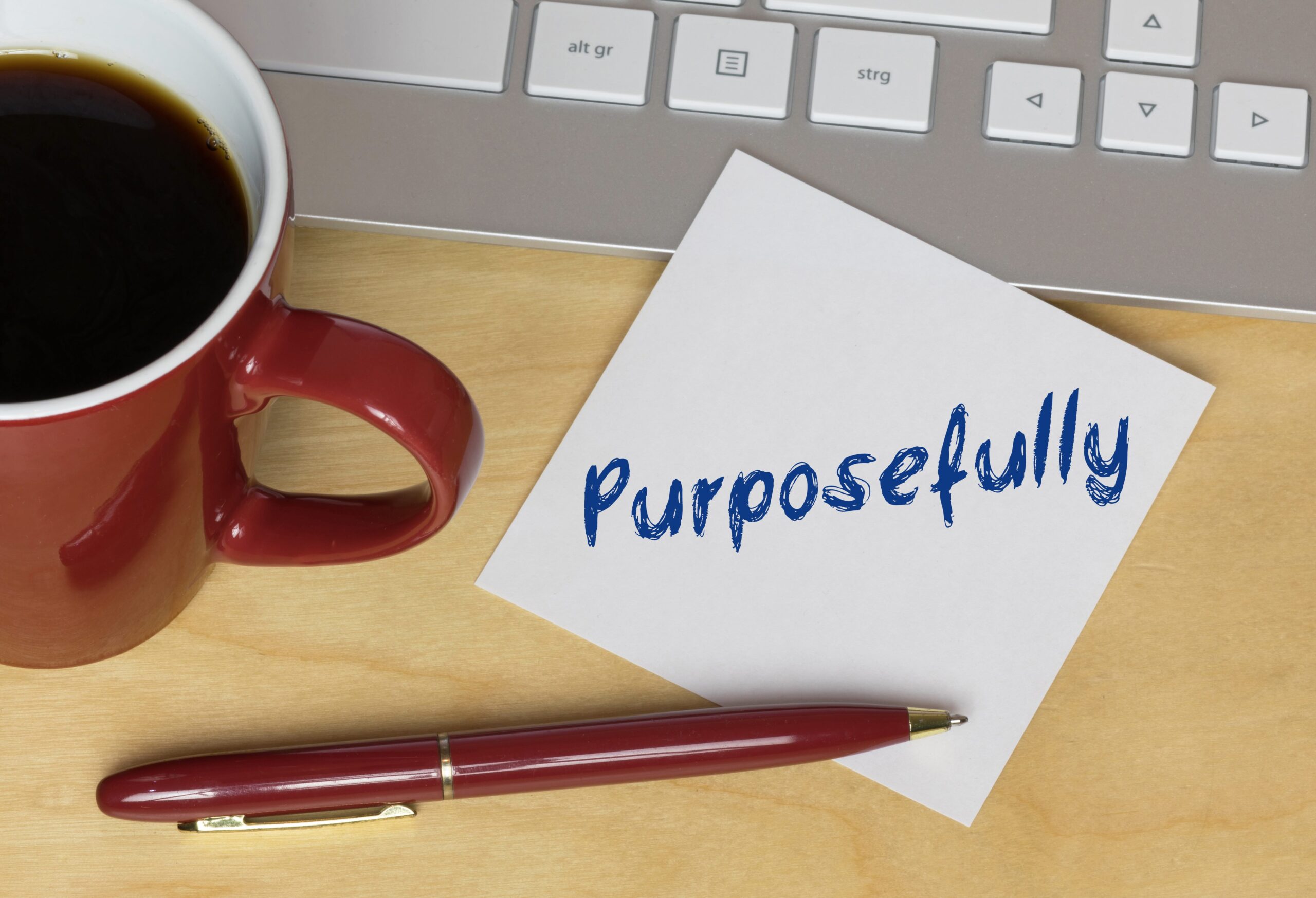 a sticky note with the word "purposefully" written on it, symbolizing life purpose